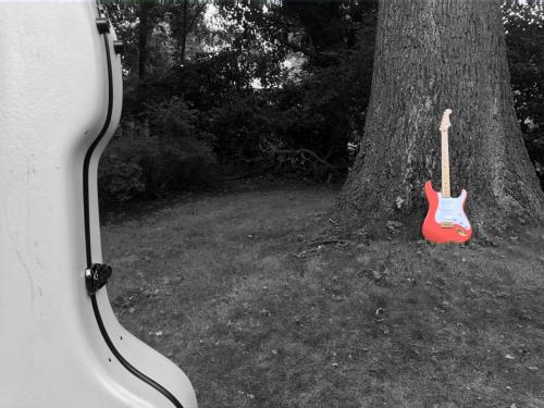 Red Stratocaster and Guitar Case